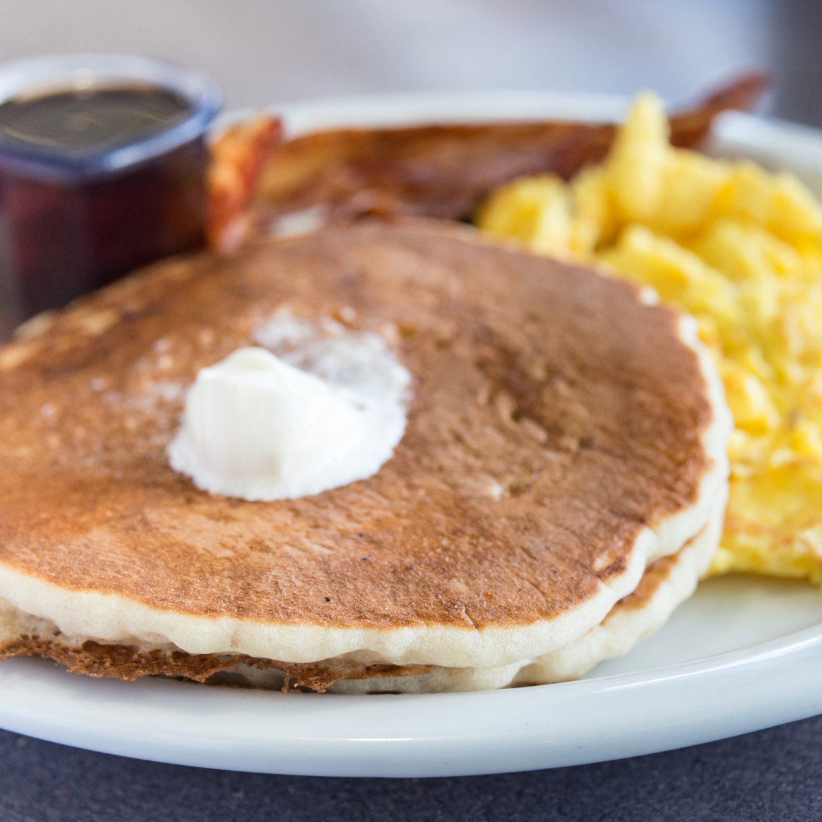 Savory morning pancakes with scrambled eggs and bacon