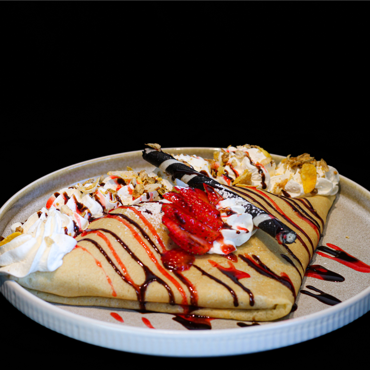 Strawberry Lover crêpe with strawberries, whipped cream and chocolate sauce